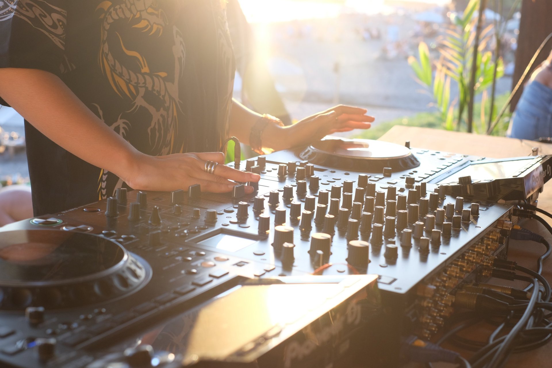DJ performing during sunset on the beach