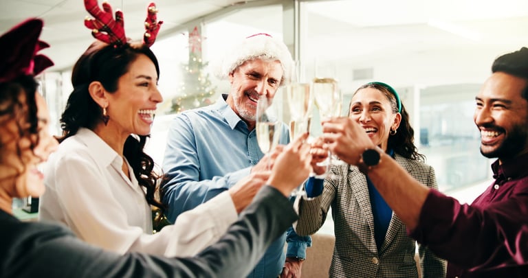 Business people celebrating with champagne at office party
