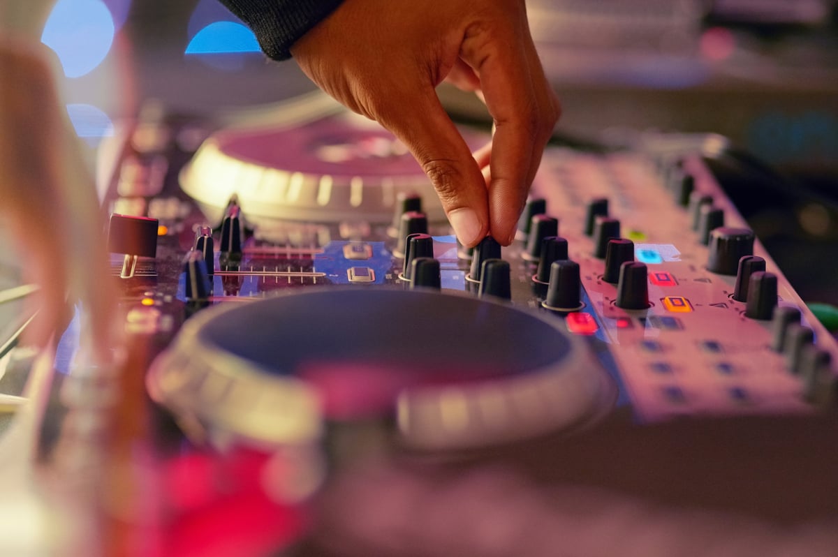 Closeup shot of a DJ mixing music on a turntable